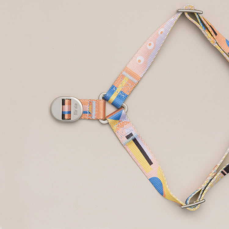 Close-up of the Una dog harness metal lock and straps