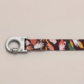 Fur-Sie Clemens leash showing a close-up of the silver locking carabiner and abstract earthy-toned pattern on a light gray background