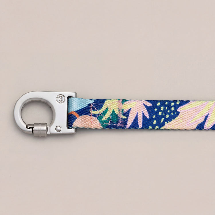 Fran dog leash with floral botanic pattern on a light gray background