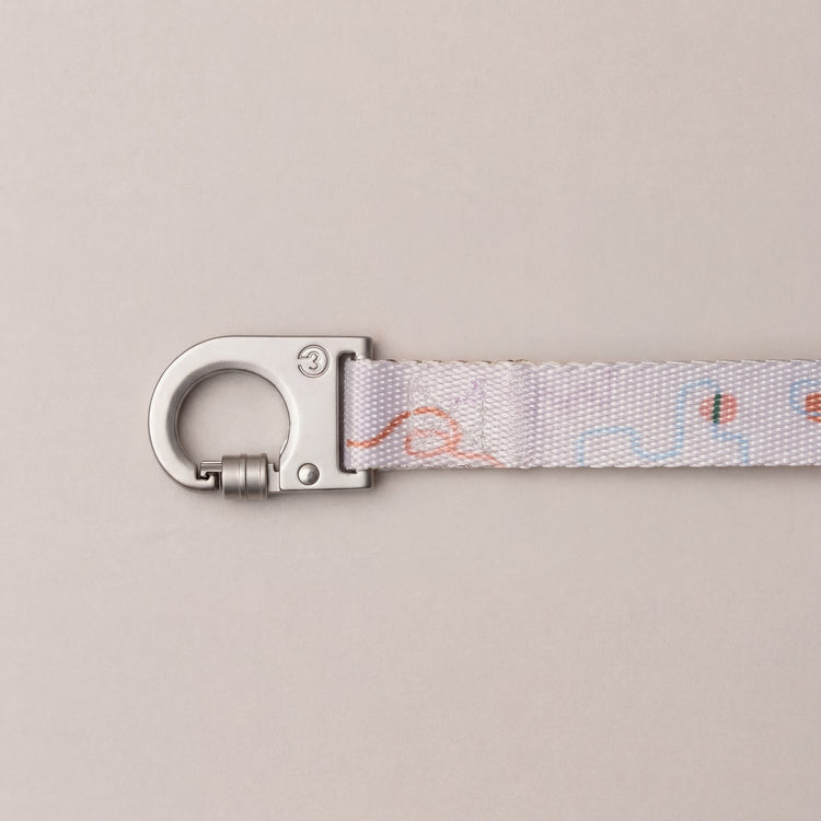 Matteo dog leash with push-lock metal hook and soft pastel abstract pattern on a neutral background