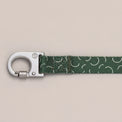 Sabine dog leash with push-lock metal hook and green pattern on a neutral background